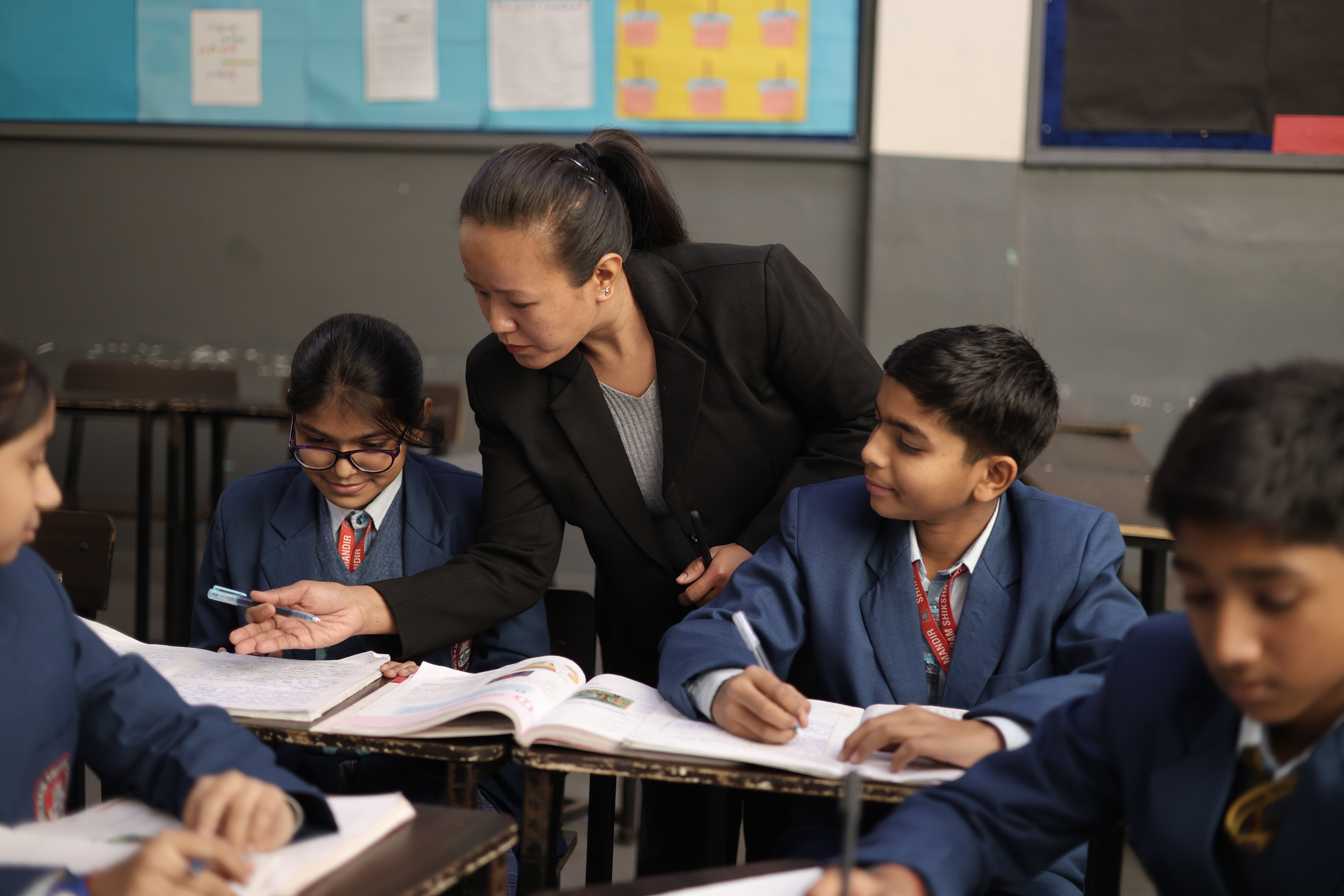 Teacher guiding students in class